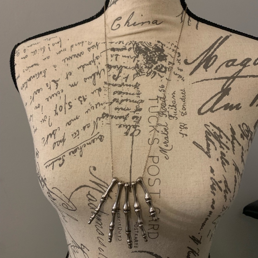 Skeleton hand necklace